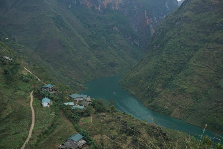 Explore the serene mountains and winding river in Hà Giang, Vietnam.