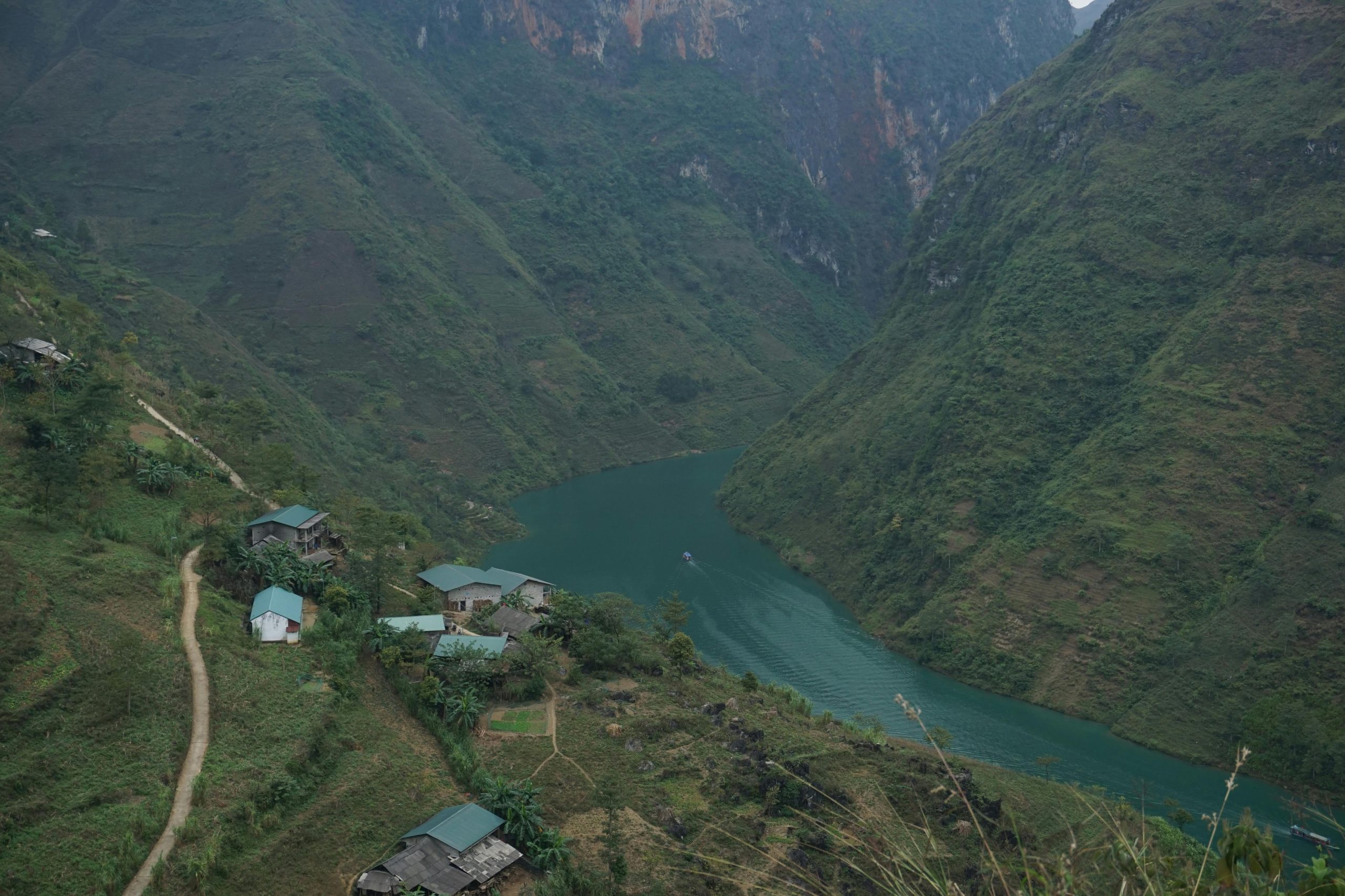 Explore the serene mountains and winding river in Hà Giang, Vietnam.